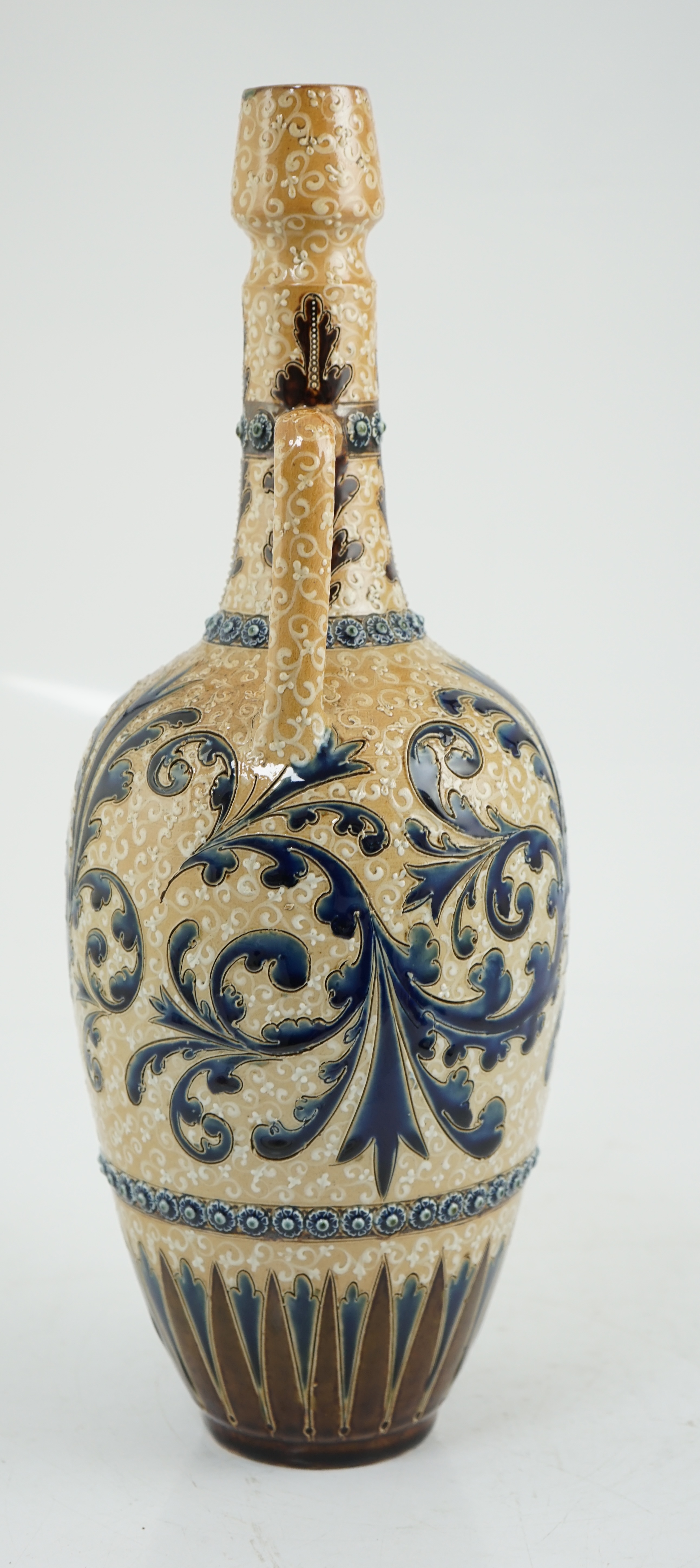George Tinworth for Doulton Lambeth, a large stoneware vase, with scrolling blue foliate decoration, monogrammed and dated 1884, 40cm high. Condition - good